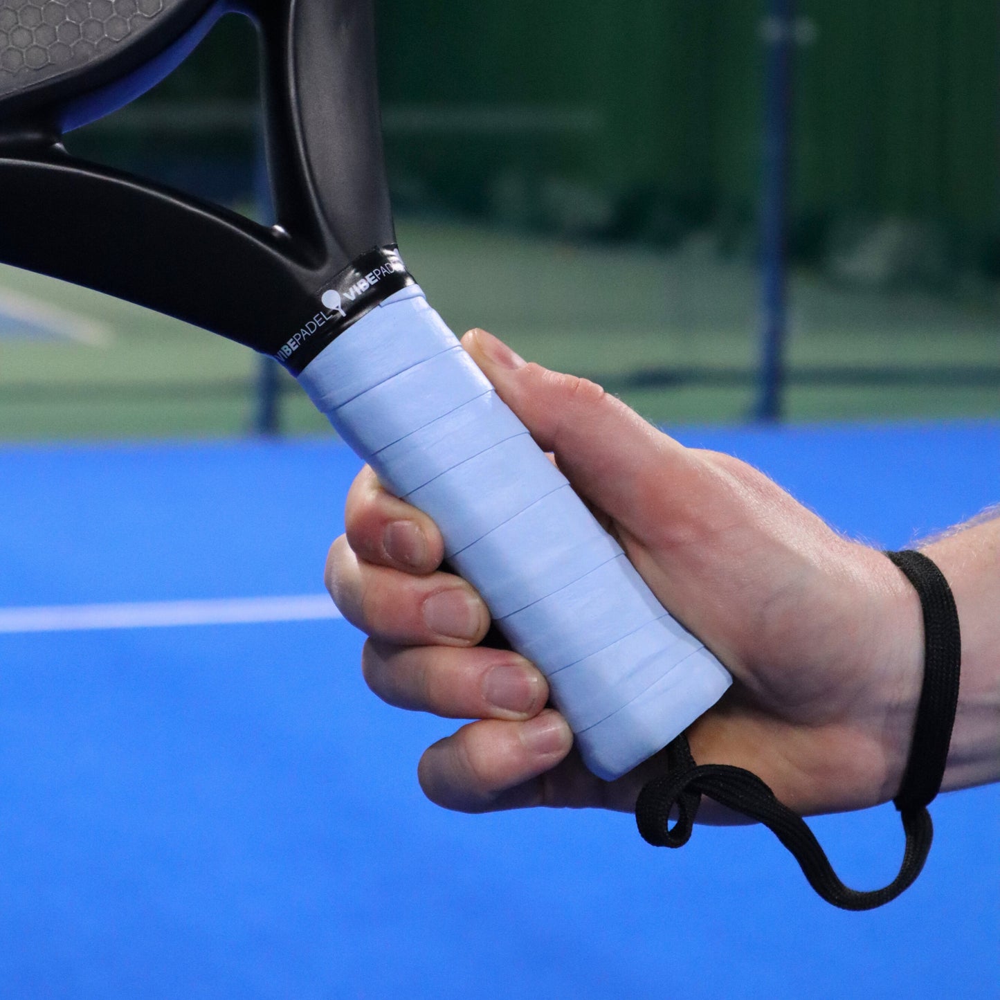 Blue VIBEPADEL Grip n Rip Padel Racket Overgrip on Padel Court
