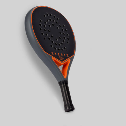 Gray and orange padel racket for beginner on a light gray background