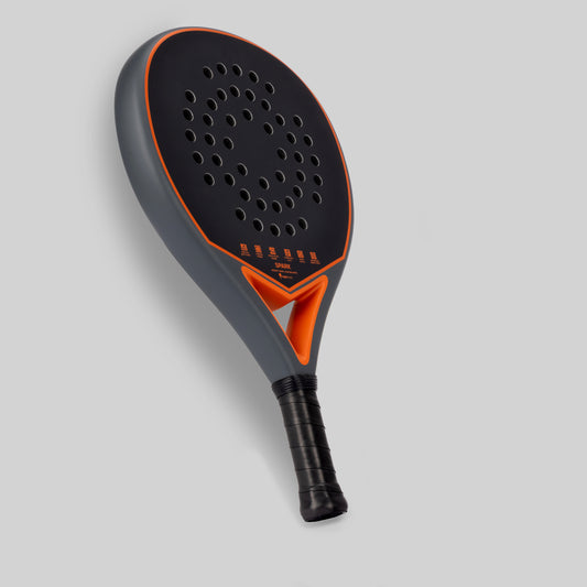 Gray and orange padel racket for beginner on a light gray background