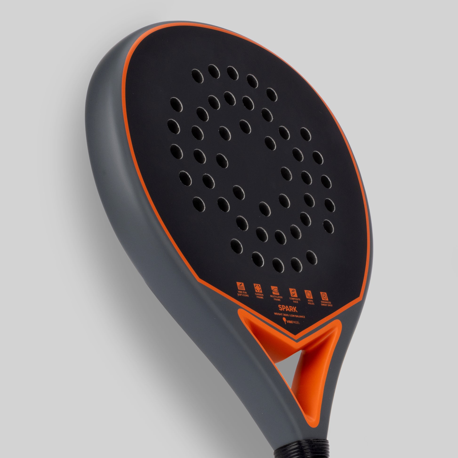 Paddle padel racket with black and orange design on a gray background