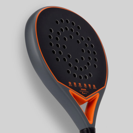 Paddle padel racket with black and orange design on a gray background