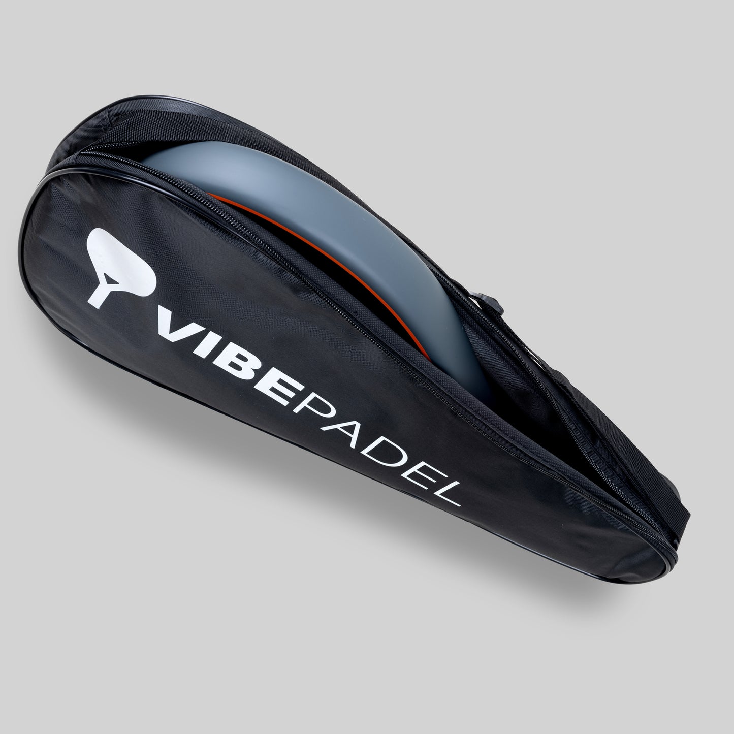 Spark Padel racket with case on a grey background