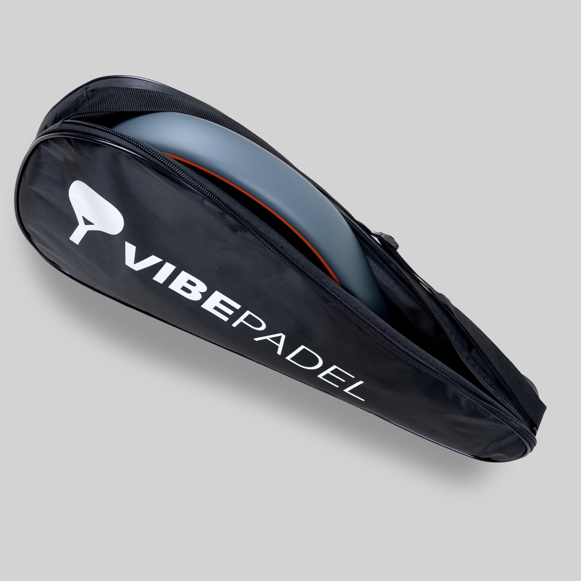 Spark Padel racket with case on a grey background